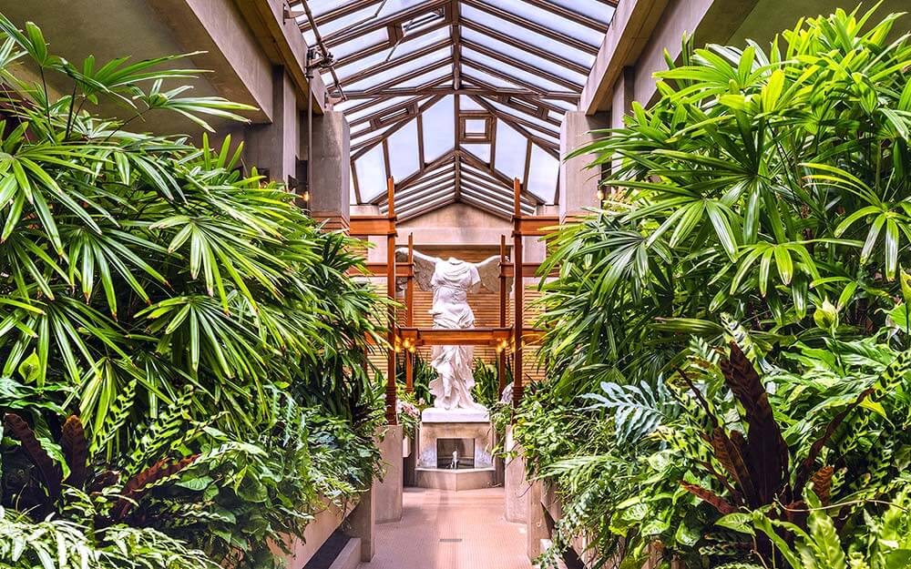 Frank Lloyd Wright’s Martin House Complex in Buffalo features a beautiful conservatory with a replica statue of “Winged Victory.”